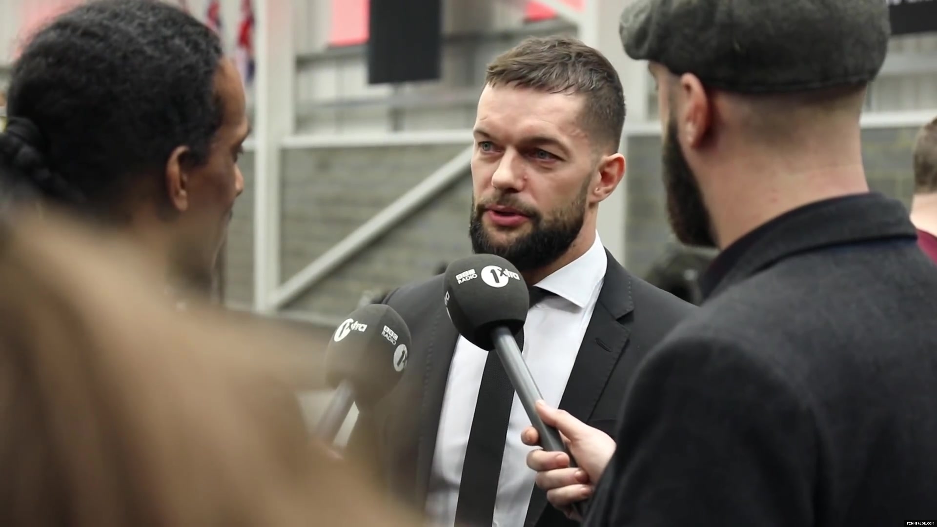 WWE_Superstar_FINN_BALOR_joins_MOUSTACHE_MOUNTAIN_at_the_opening_of_the_NXT_UK_PC_025.jpg