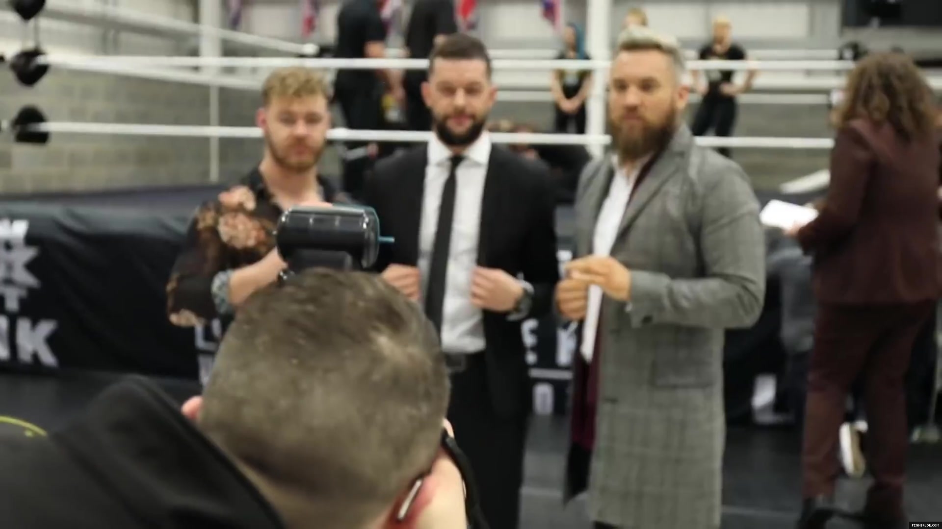 WWE_Superstar_FINN_BALOR_joins_MOUSTACHE_MOUNTAIN_at_the_opening_of_the_NXT_UK_PC_031.jpg