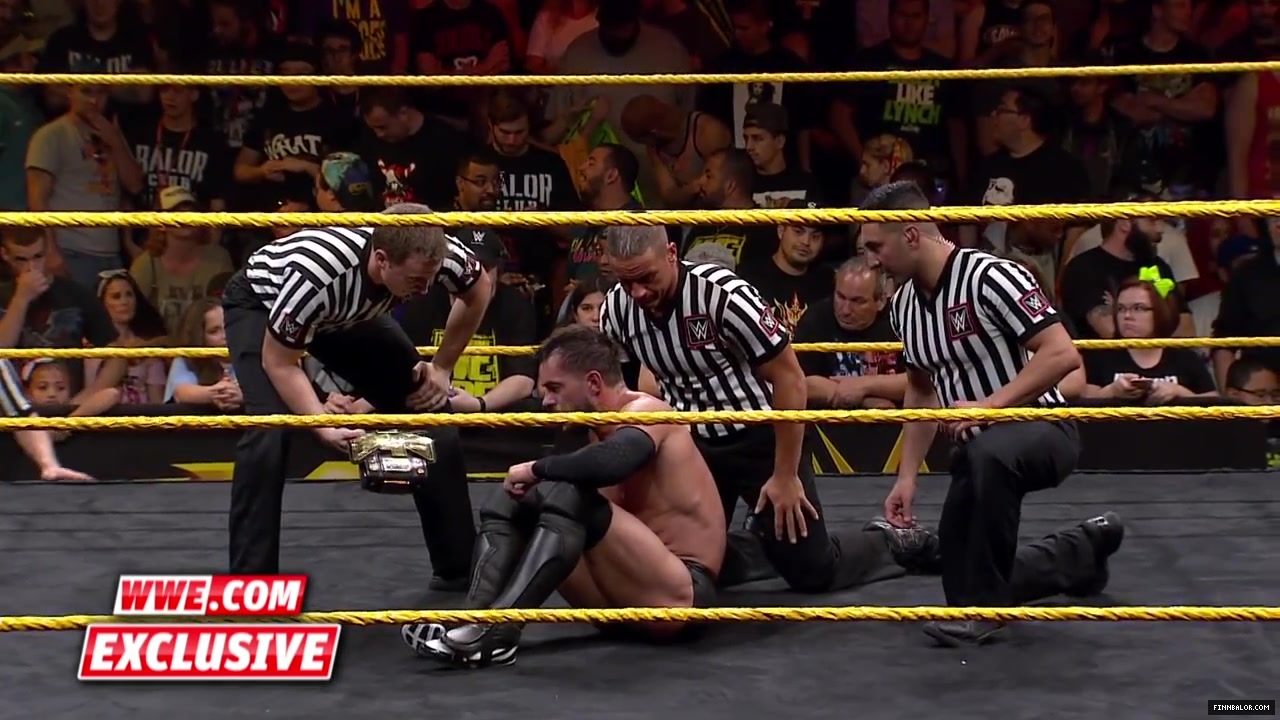 Finn_B_lor_and_Apollo_Crews_are_helped_backstage-_WWE_com_Exclusive2C_Nov__42C_2015_042.jpg