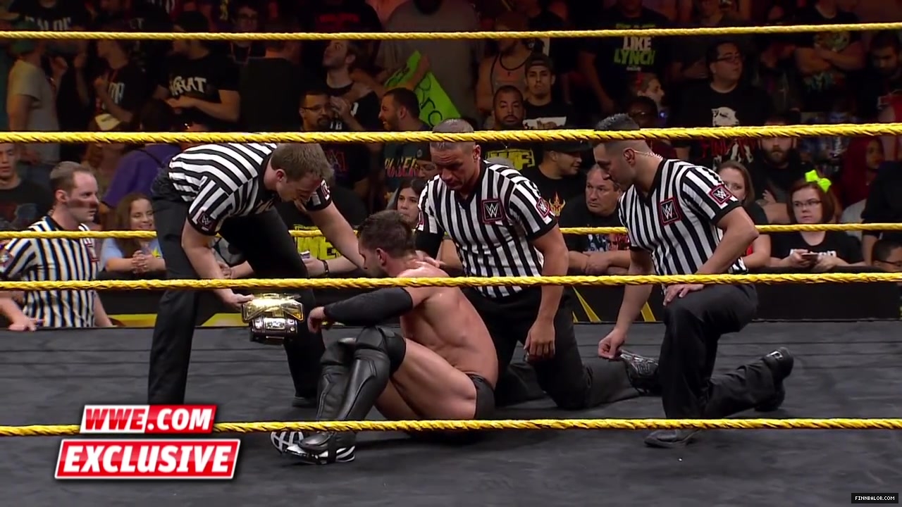 Finn_B_lor_and_Apollo_Crews_are_helped_backstage-_WWE_com_Exclusive2C_Nov__42C_2015_046.jpg