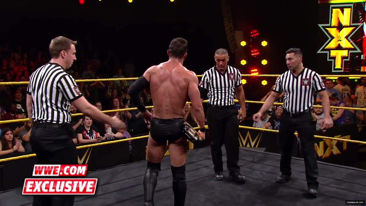 Finn_B_lor_and_Apollo_Crews_are_helped_backstage-_WWE_com_Exclusive2C_Nov__42C_2015_055.jpg