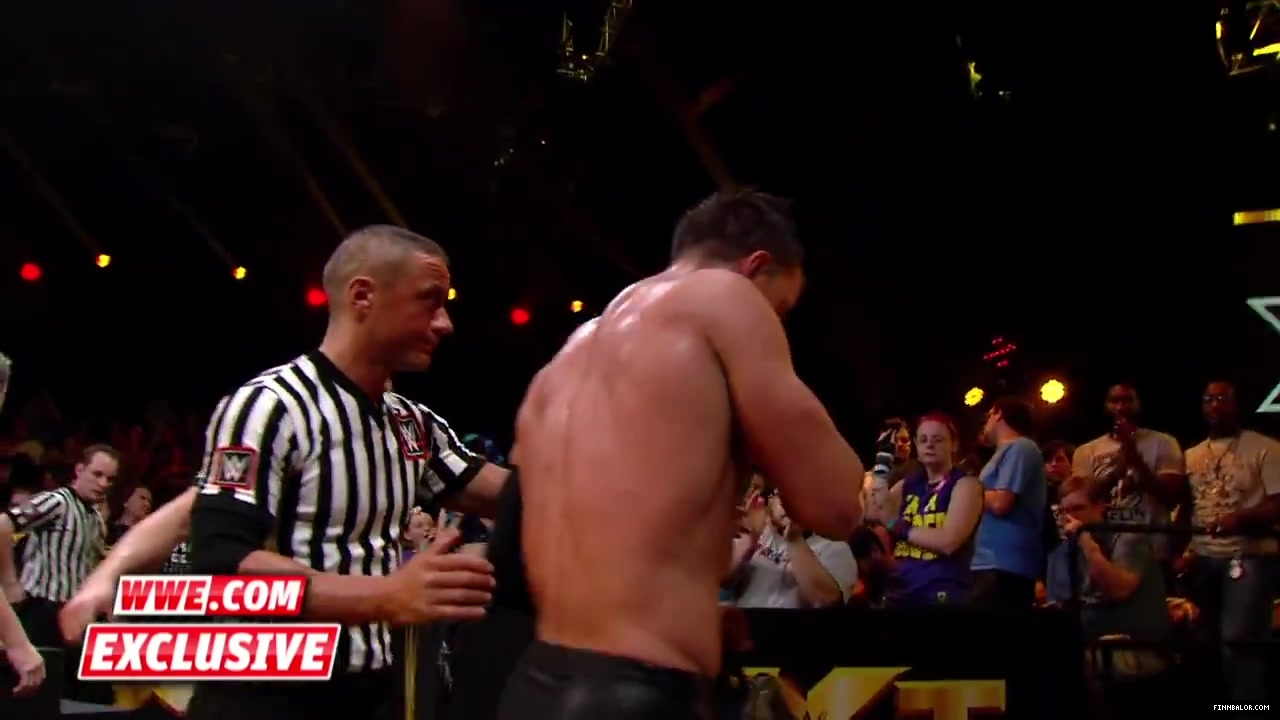 Finn_B_lor_and_Apollo_Crews_are_helped_backstage-_WWE_com_Exclusive2C_Nov__42C_2015_084.jpg