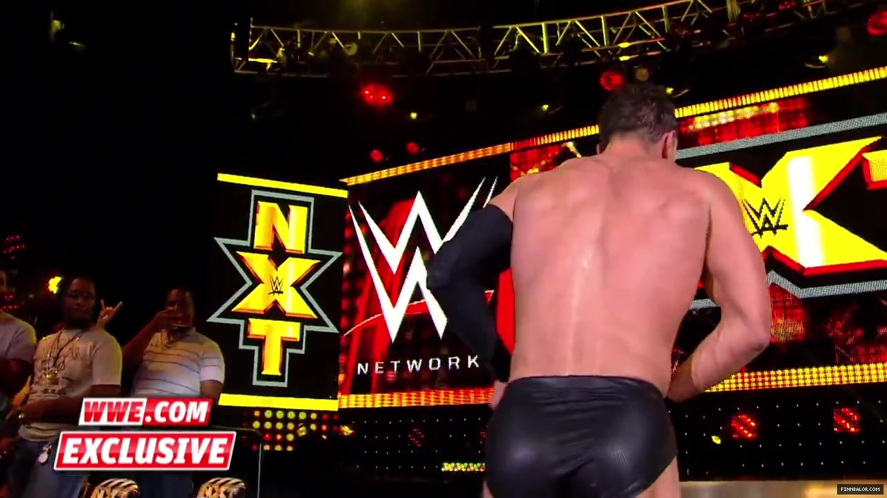 Finn_B_lor_and_Apollo_Crews_are_helped_backstage-_WWE_com_Exclusive2C_Nov__42C_2015_088.jpg