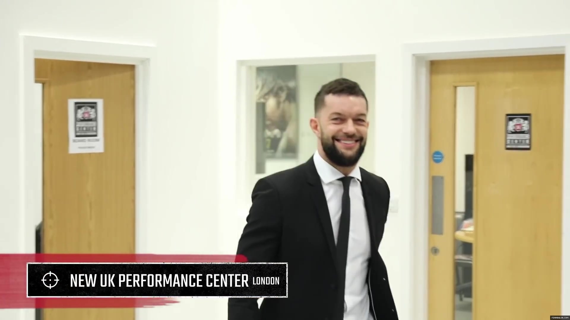WWE_Superstar_FINN_BALOR_joins_MOUSTACHE_MOUNTAIN_at_the_opening_of_the_NXT_UK_PC_013.jpg