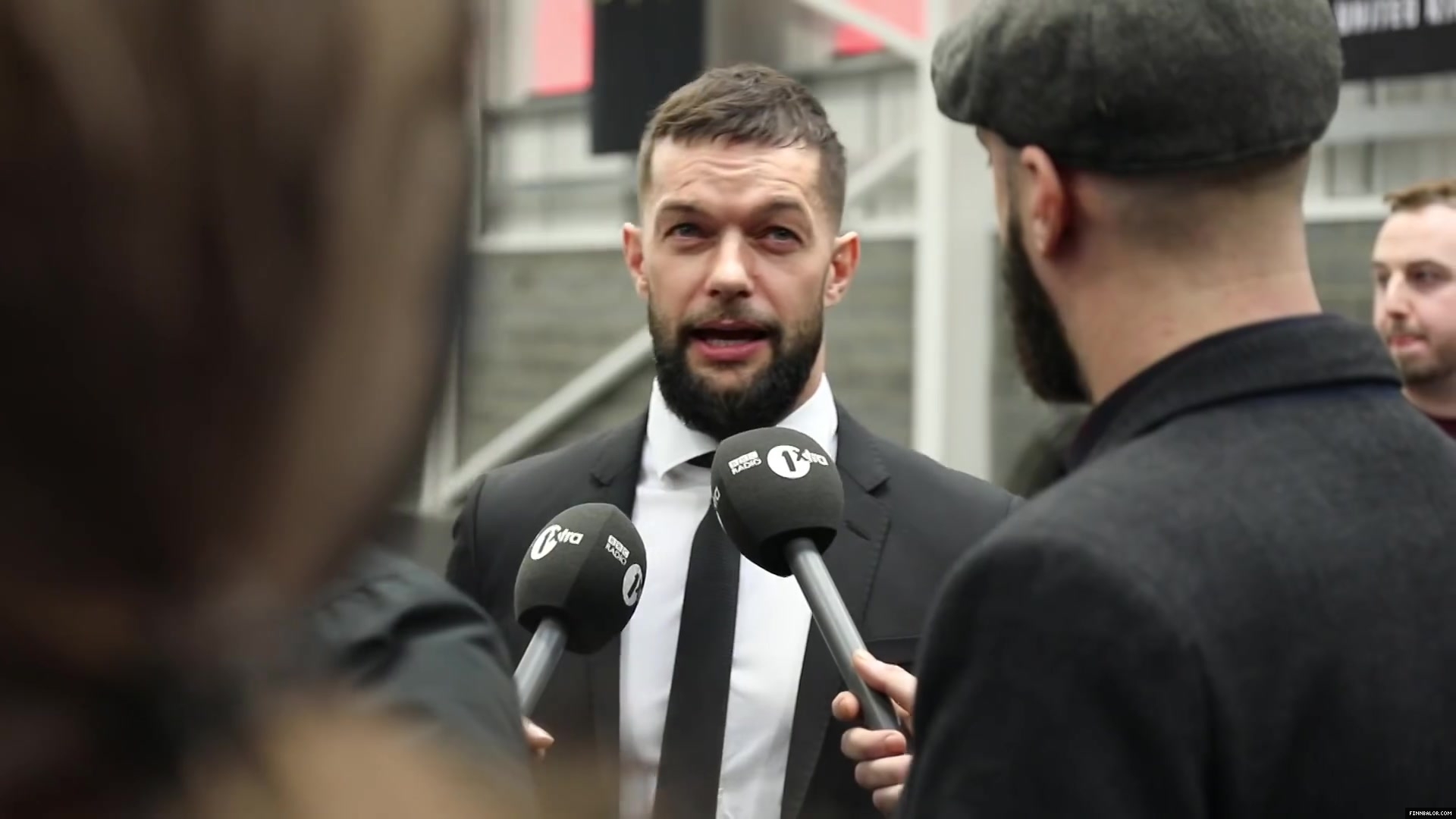 WWE_Superstar_FINN_BALOR_joins_MOUSTACHE_MOUNTAIN_at_the_opening_of_the_NXT_UK_PC_018.jpg