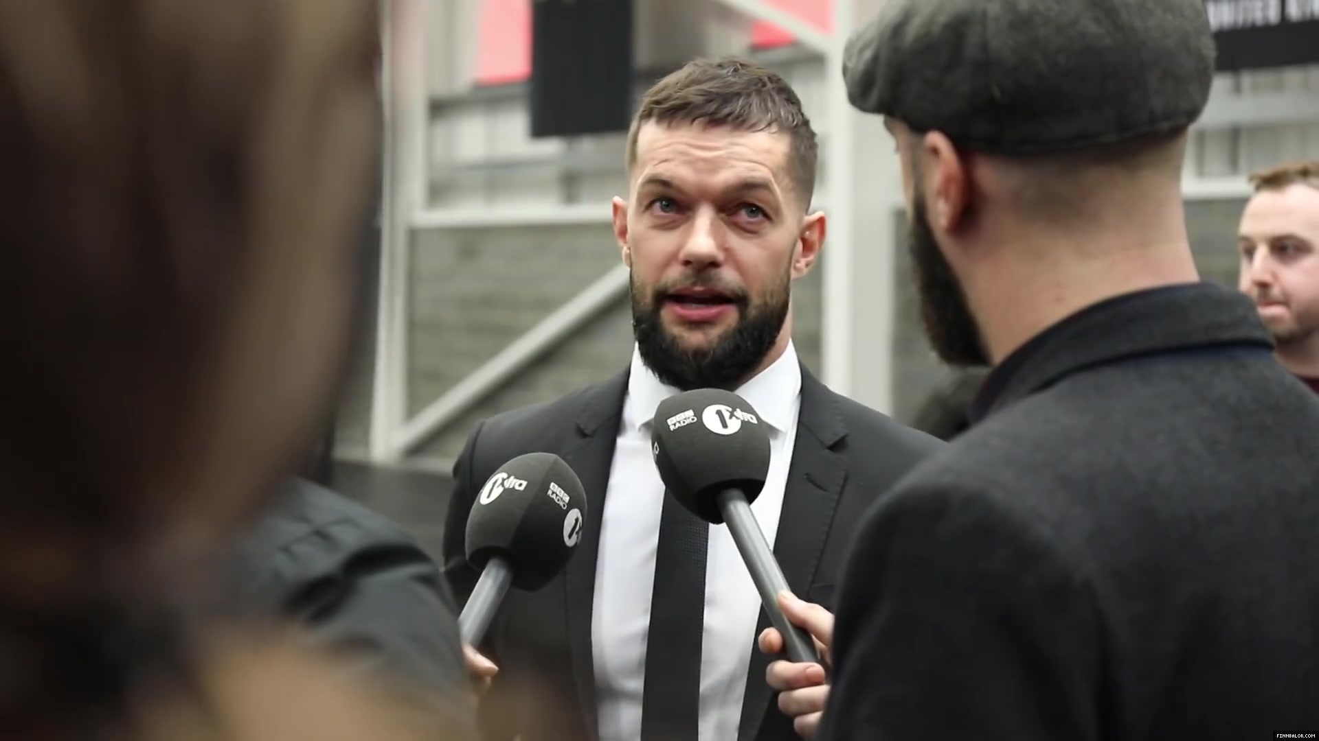 WWE_Superstar_FINN_BALOR_joins_MOUSTACHE_MOUNTAIN_at_the_opening_of_the_NXT_UK_PC_019.jpg