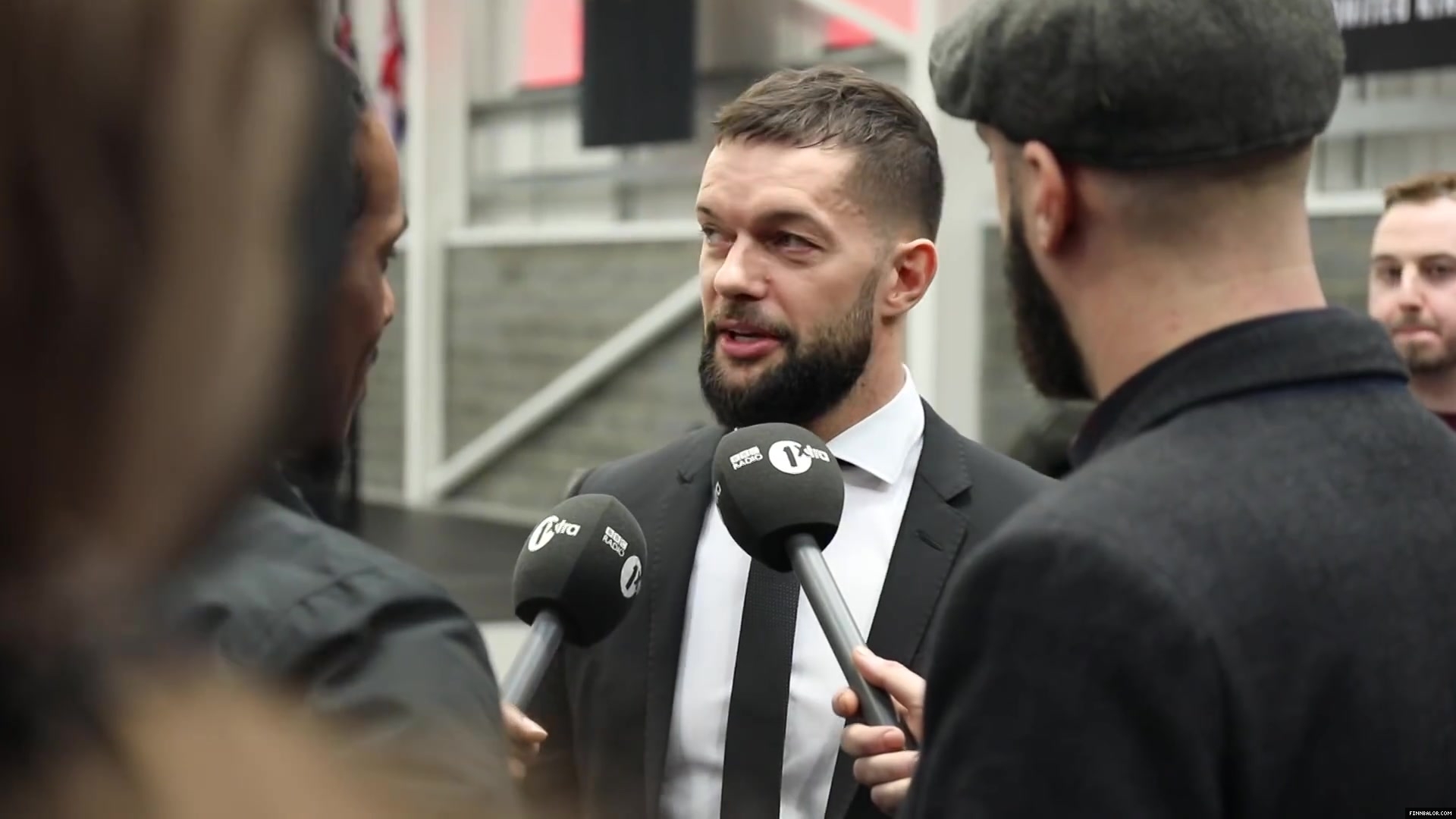 WWE_Superstar_FINN_BALOR_joins_MOUSTACHE_MOUNTAIN_at_the_opening_of_the_NXT_UK_PC_020.jpg