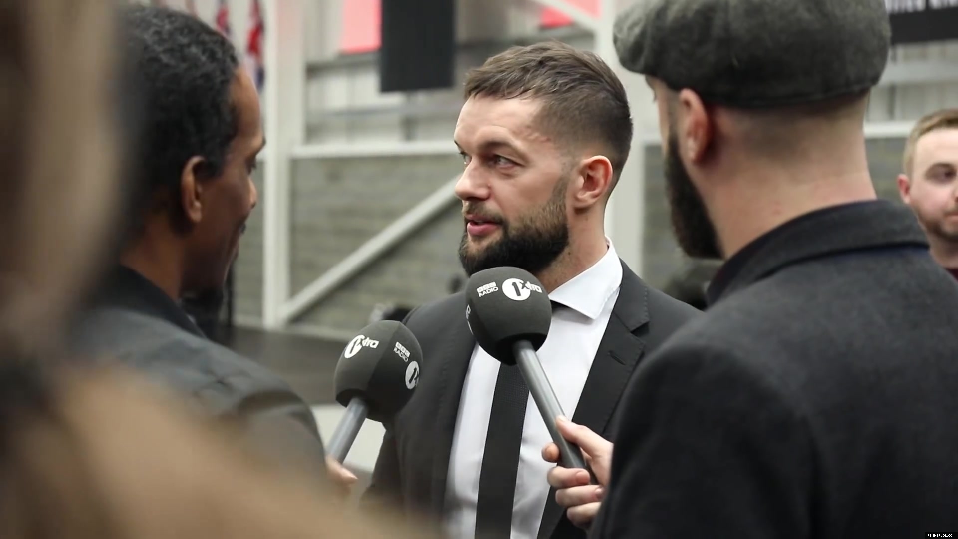 WWE_Superstar_FINN_BALOR_joins_MOUSTACHE_MOUNTAIN_at_the_opening_of_the_NXT_UK_PC_021.jpg
