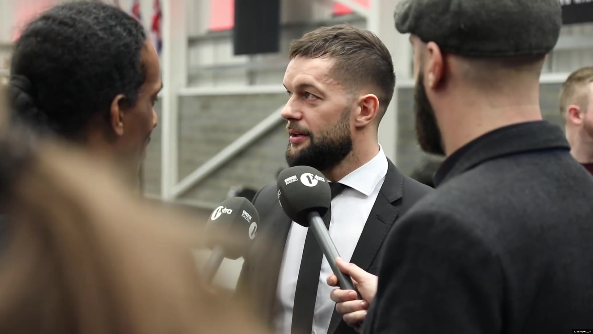 WWE_Superstar_FINN_BALOR_joins_MOUSTACHE_MOUNTAIN_at_the_opening_of_the_NXT_UK_PC_022.jpg
