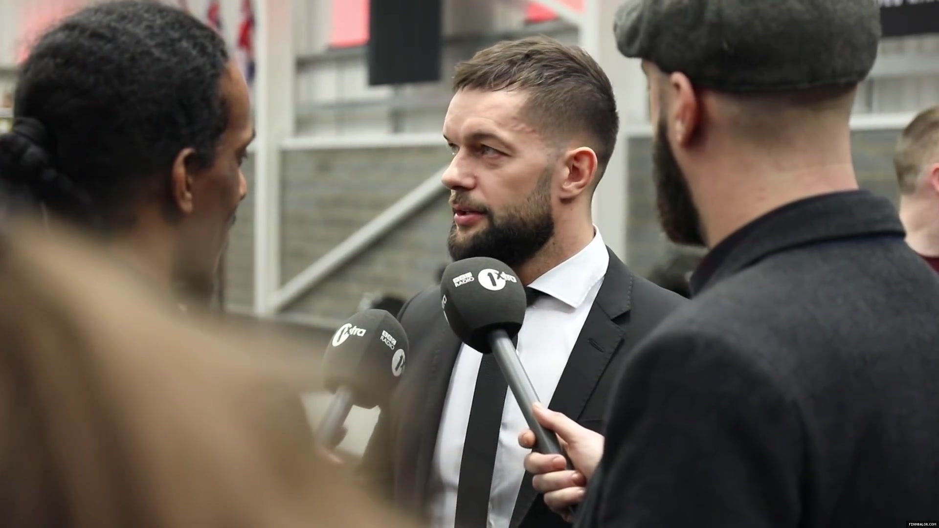 WWE_Superstar_FINN_BALOR_joins_MOUSTACHE_MOUNTAIN_at_the_opening_of_the_NXT_UK_PC_023.jpg
