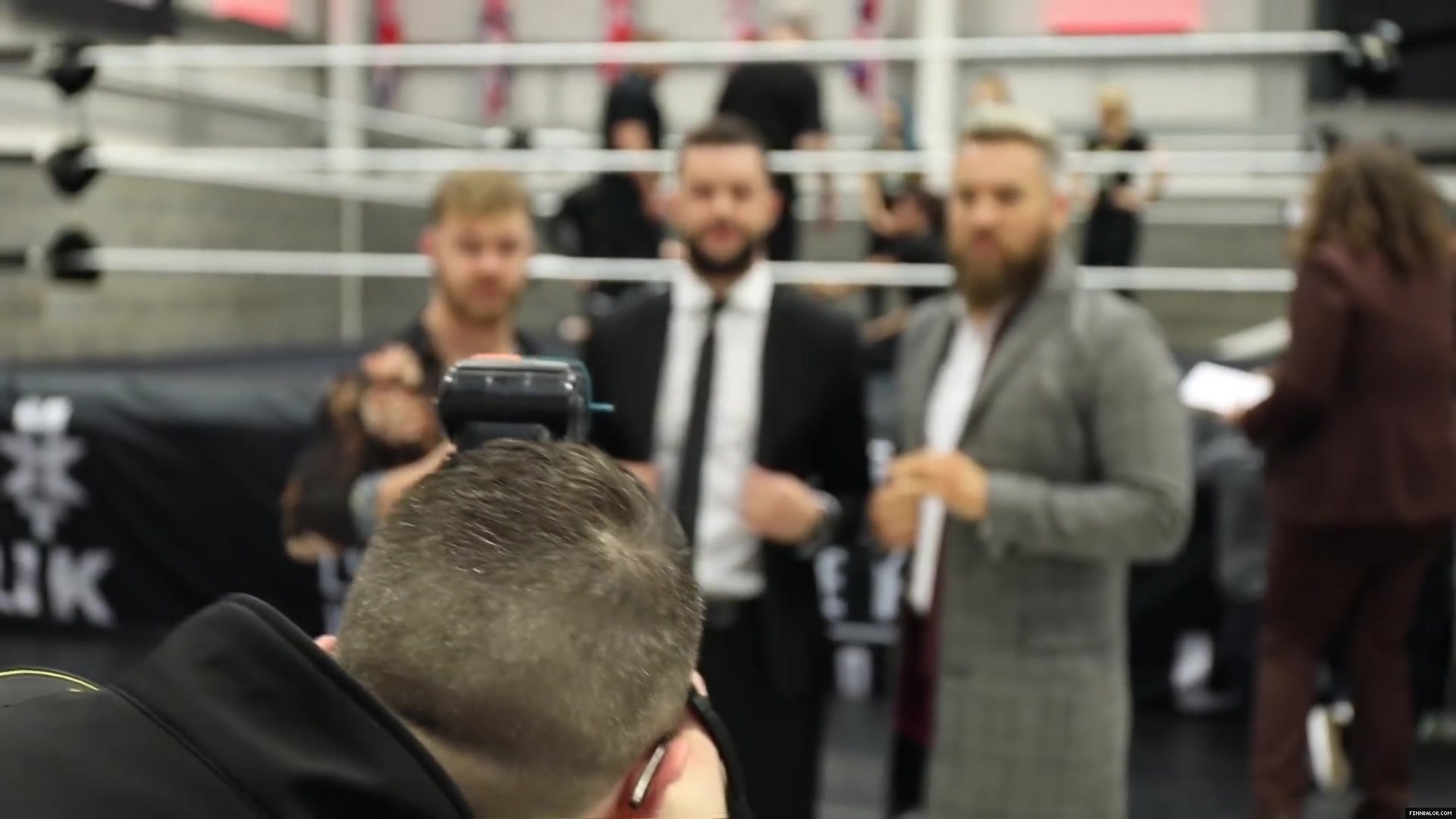 WWE_Superstar_FINN_BALOR_joins_MOUSTACHE_MOUNTAIN_at_the_opening_of_the_NXT_UK_PC_034.jpg