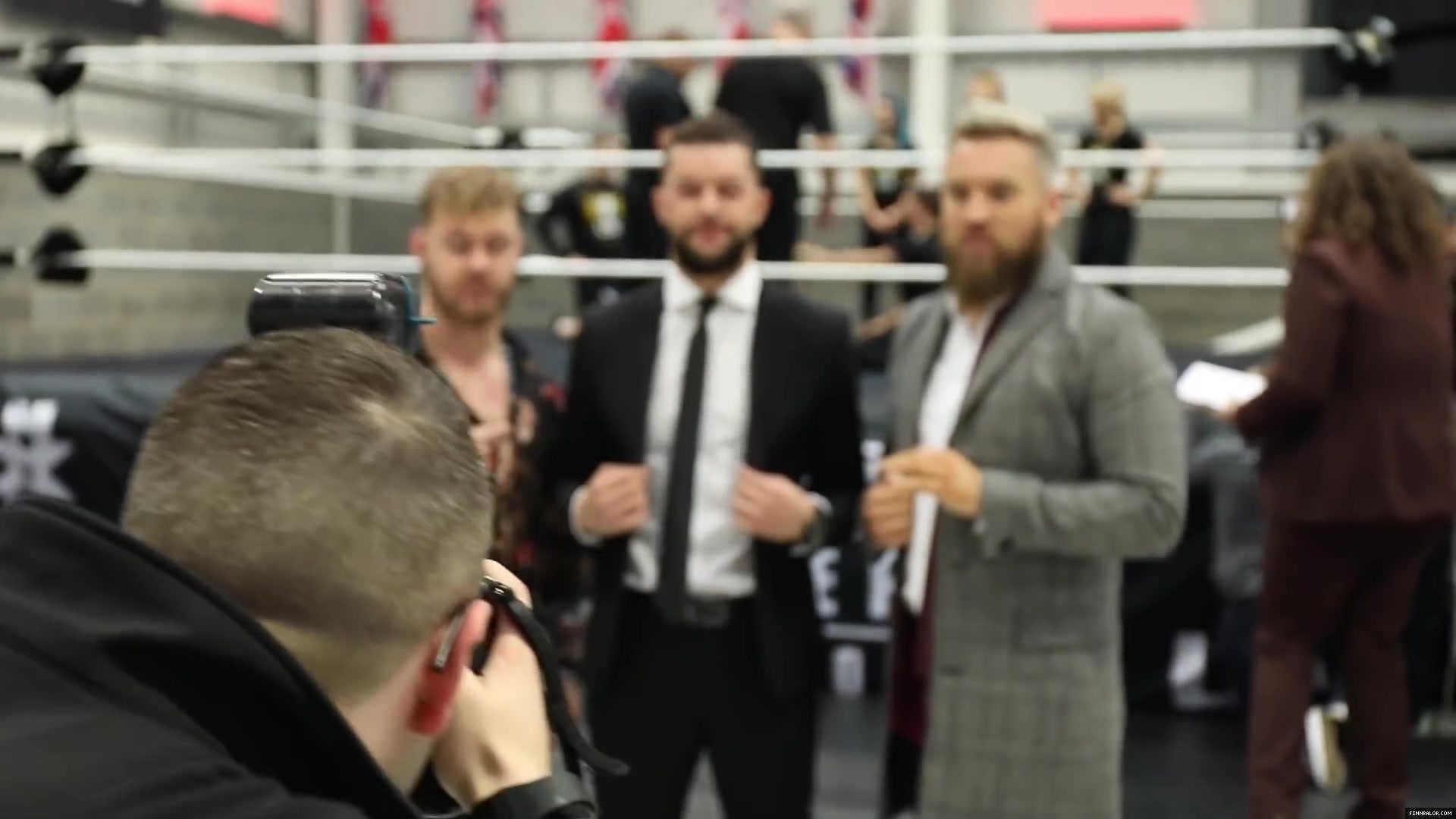 WWE_Superstar_FINN_BALOR_joins_MOUSTACHE_MOUNTAIN_at_the_opening_of_the_NXT_UK_PC_035.jpg