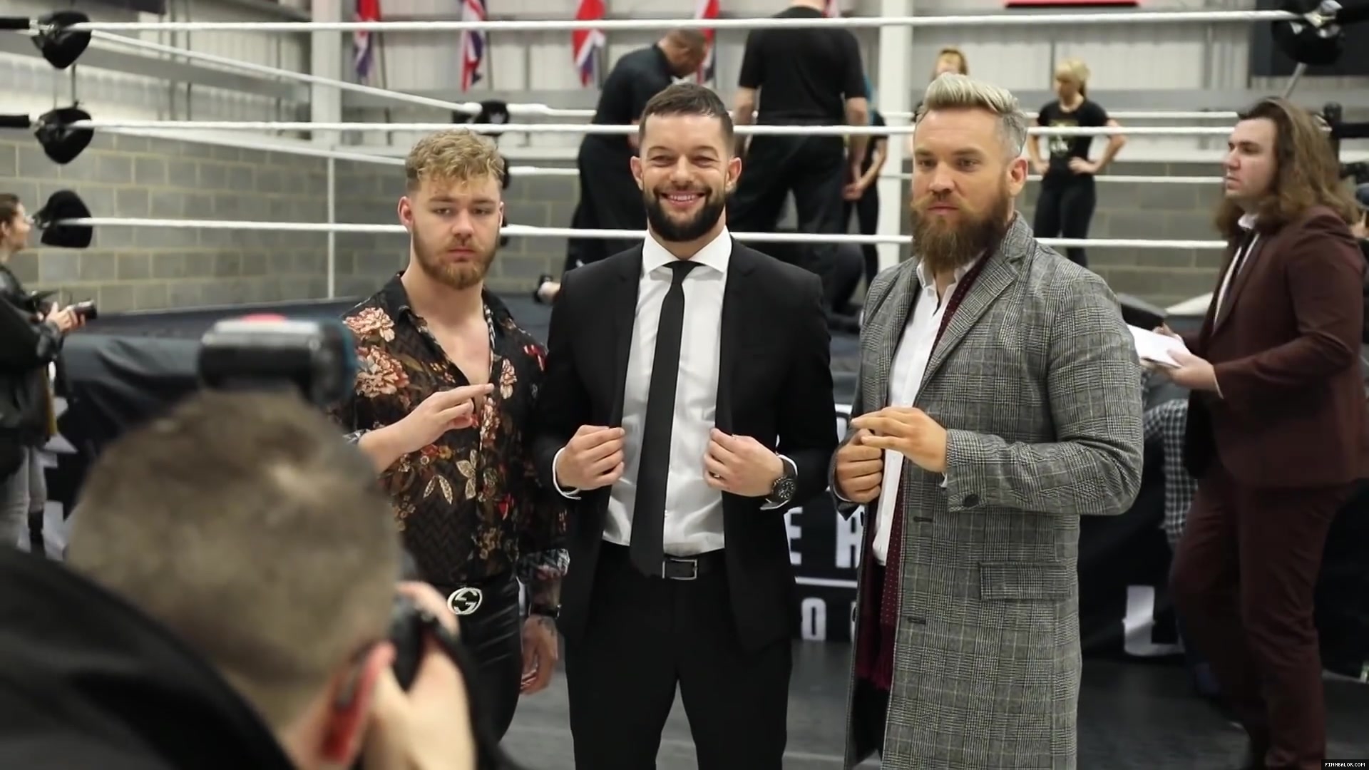 WWE_Superstar_FINN_BALOR_joins_MOUSTACHE_MOUNTAIN_at_the_opening_of_the_NXT_UK_PC_040.jpg