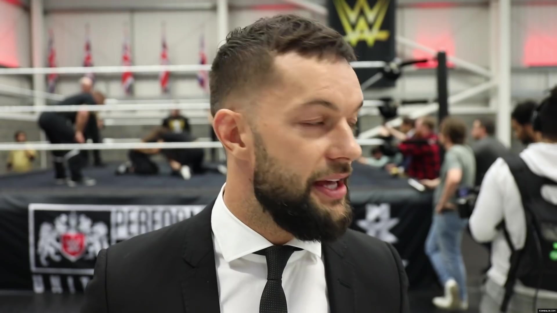 WWE_Superstar_FINN_BALOR_joins_MOUSTACHE_MOUNTAIN_at_the_opening_of_the_NXT_UK_PC_140.jpg
