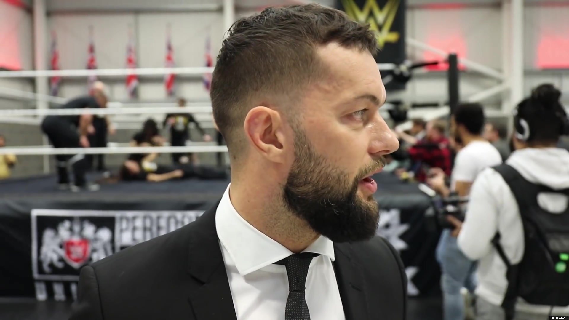 WWE_Superstar_FINN_BALOR_joins_MOUSTACHE_MOUNTAIN_at_the_opening_of_the_NXT_UK_PC_143.jpg